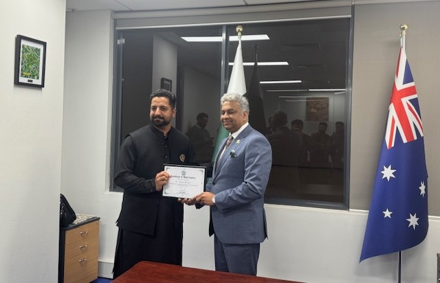 A person holding a certificate

AI-generated content may be incorrect.