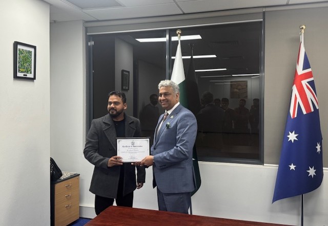 A person holding a certificate

AI-generated content may be incorrect.