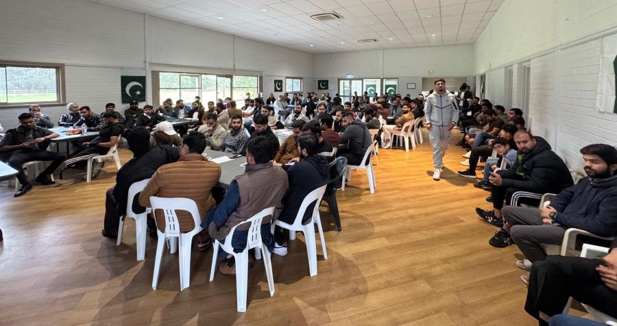 A group of people sitting in chairs in a room

AI-generated content may be incorrect.