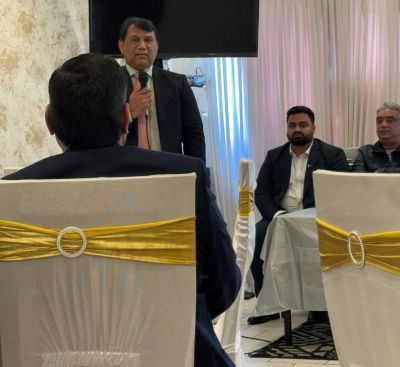 A group of men sitting at a table

AI-generated content may be incorrect.