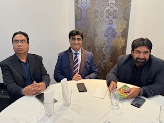 A group of men sitting at a round table

AI-generated content may be incorrect.