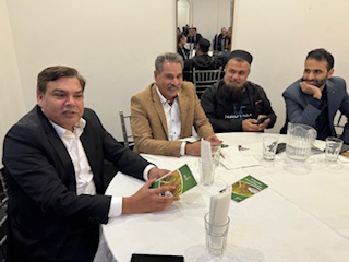 A group of men sitting at a round table

AI-generated content may be incorrect.