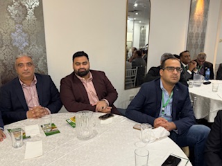 A group of men sitting at a round table

AI-generated content may be incorrect.