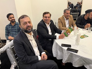 A group of men sitting at a table

AI-generated content may be incorrect.