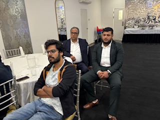 A group of men sitting at a table

AI-generated content may be incorrect.