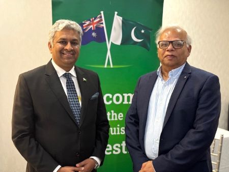 Two men standing in front of a flag

AI-generated content may be incorrect.