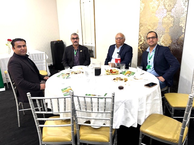A group of men sitting at a round table

AI-generated content may be incorrect.