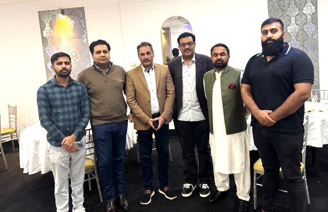 A group of men standing together

AI-generated content may be incorrect.