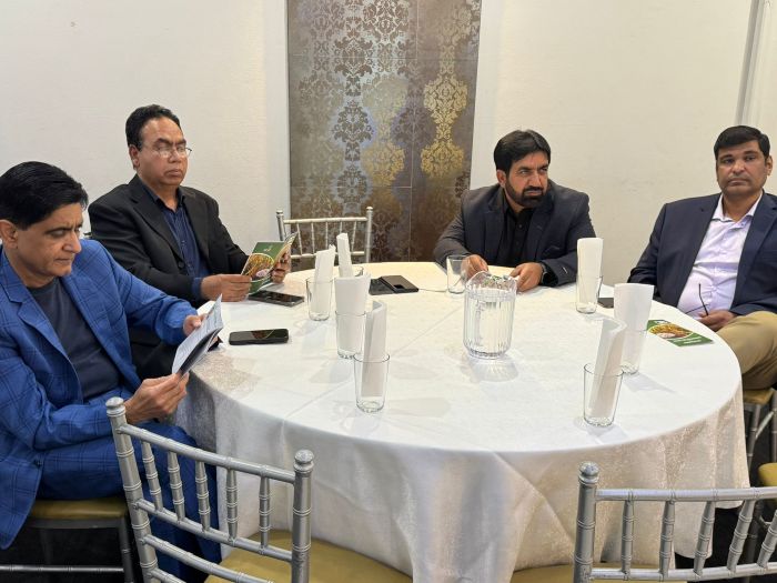 A group of men sitting at a round table

AI-generated content may be incorrect.