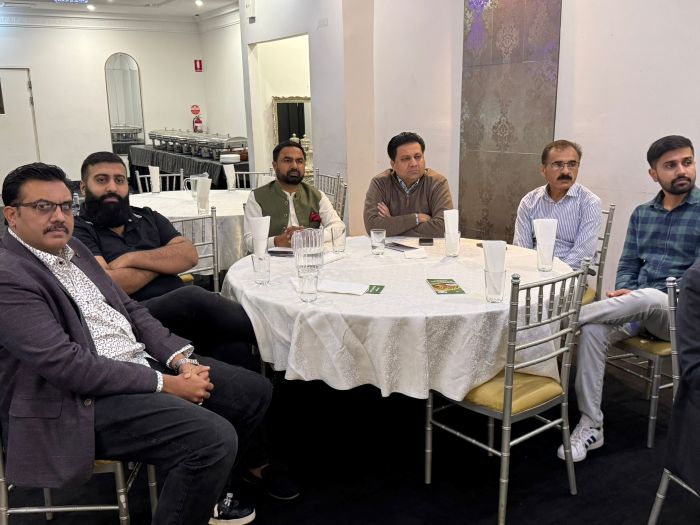 A group of men sitting around a round table

AI-generated content may be incorrect.