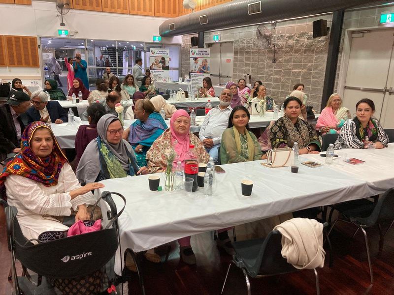 A group of people sitting at tables

AI-generated content may be incorrect.