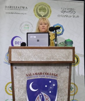 A person standing at a podium

AI-generated content may be incorrect.