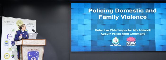 A person standing in front of a screen

AI-generated content may be incorrect.