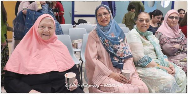 A group of women sitting in chairs

AI-generated content may be incorrect.