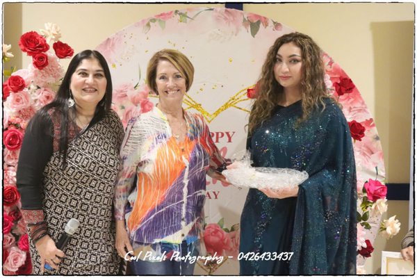 A group of women posing for a photo

AI-generated content may be incorrect.