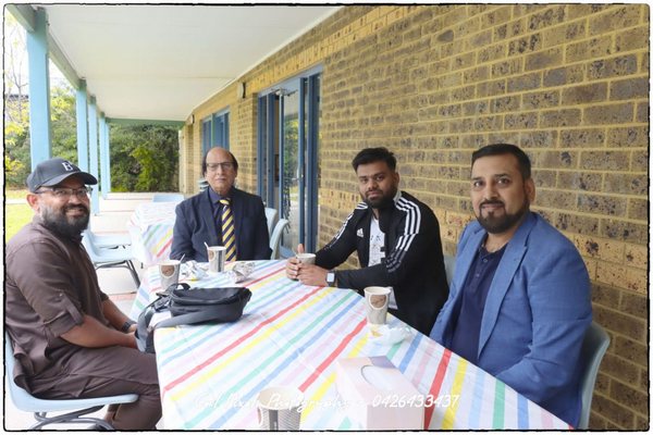 A group of men sitting at a table

AI-generated content may be incorrect.
