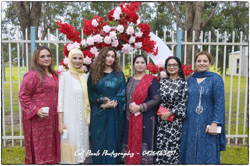 A group of women standing together

AI-generated content may be incorrect.