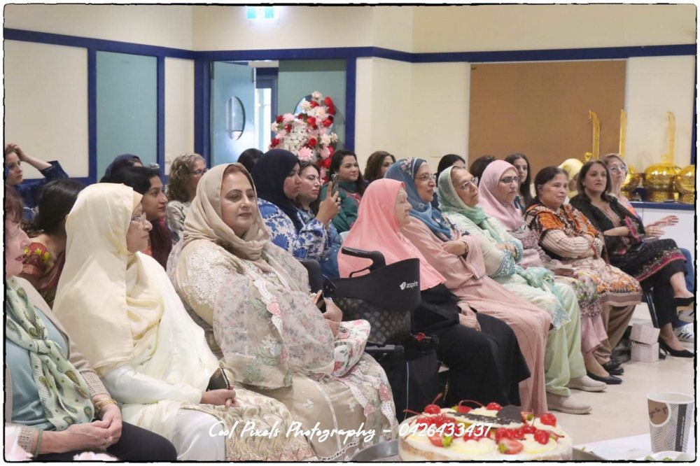 A group of women sitting in chairs

AI-generated content may be incorrect.