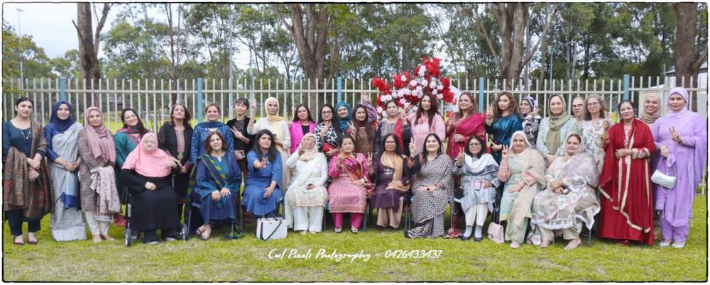 A group of women posing for a photo

AI-generated content may be incorrect.