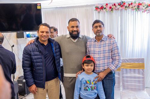 A group of men standing together

AI-generated content may be incorrect.