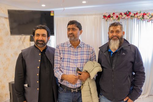 A group of men standing together

AI-generated content may be incorrect.