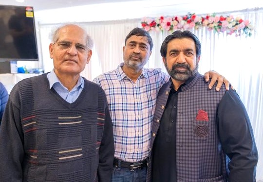 A group of men standing together

AI-generated content may be incorrect.