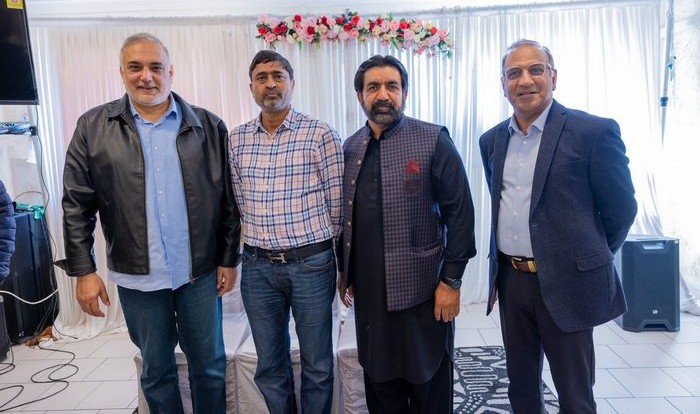 A group of men standing together

AI-generated content may be incorrect.