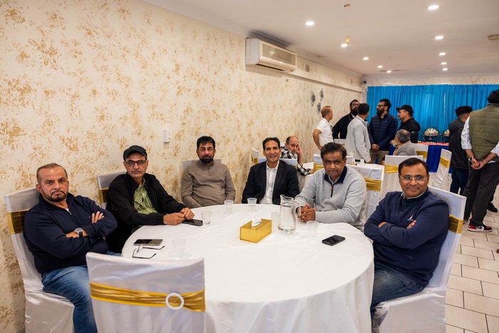 A group of men sitting at a round table

AI-generated content may be incorrect.