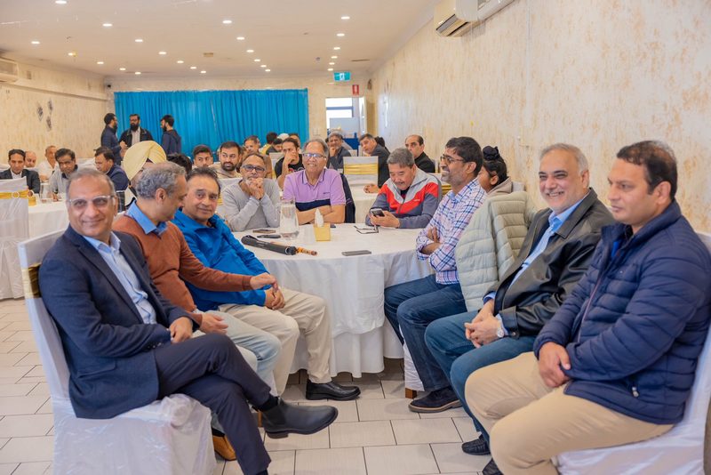 A group of people sitting around a table

AI-generated content may be incorrect.