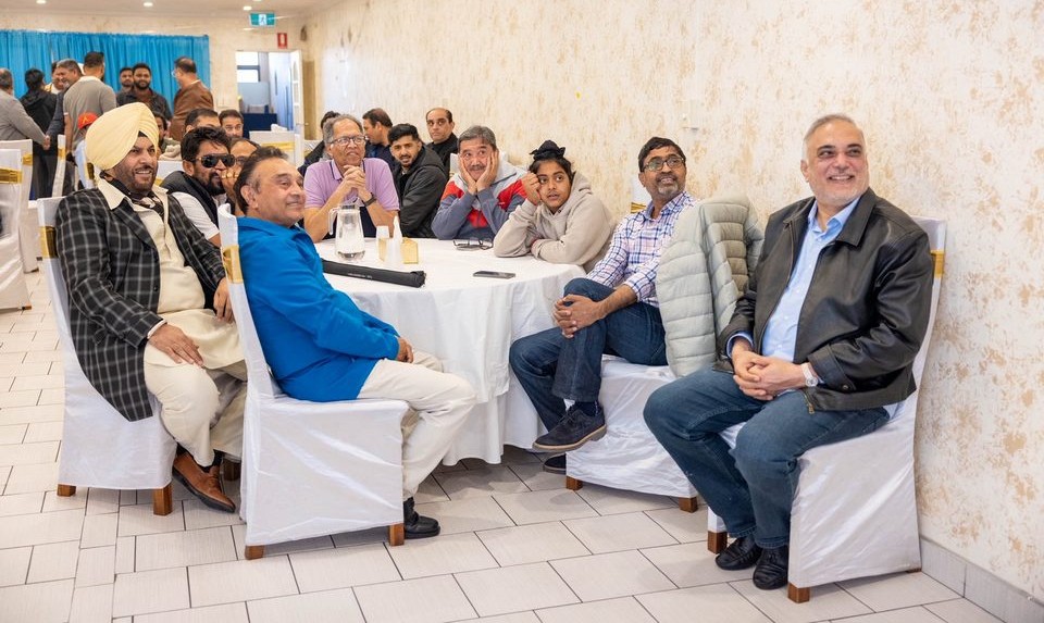 A group of people sitting at tables

AI-generated content may be incorrect.