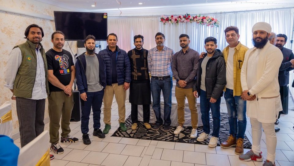 A group of men standing together

AI-generated content may be incorrect.