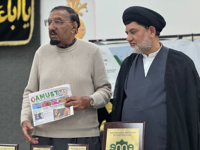 A person holding a newspaper next to another person

AI-generated content may be incorrect.