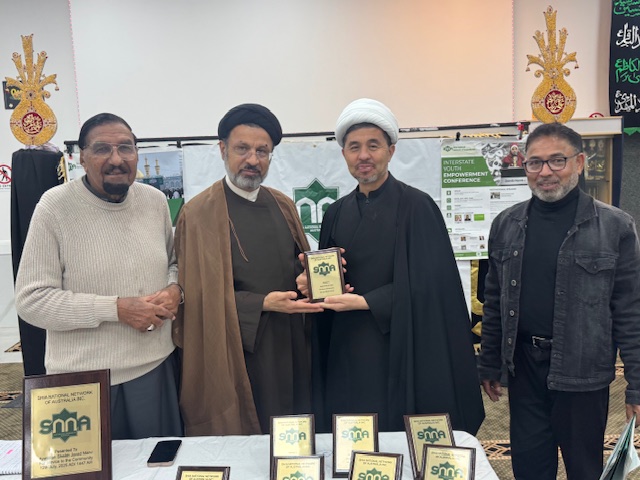 A group of men standing together holding a plaque

AI-generated content may be incorrect.