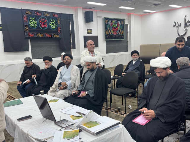 A group of men sitting in a room

AI-generated content may be incorrect.