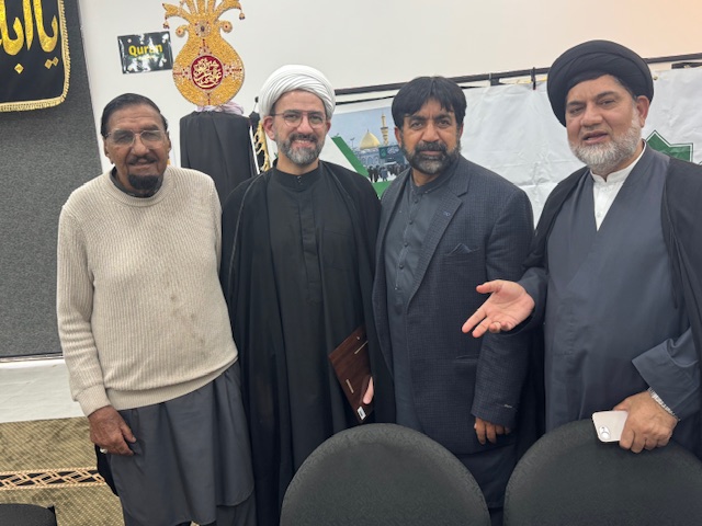 A group of men standing together

AI-generated content may be incorrect.