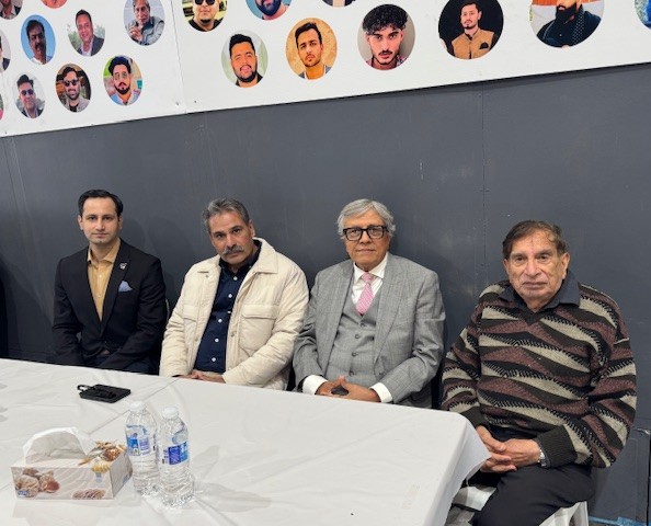 A group of men sitting at a table

AI-generated content may be incorrect.