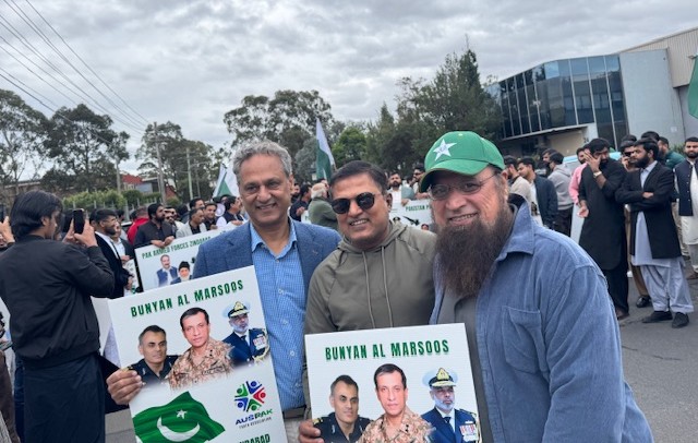 A group of men holding signs

AI-generated content may be incorrect.