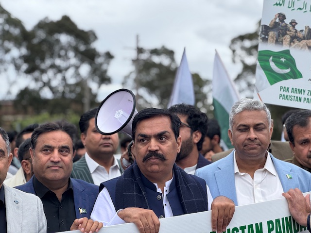 A group of people holding signs

AI-generated content may be incorrect.