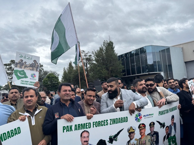 A group of people holding signs and flags

AI-generated content may be incorrect.
