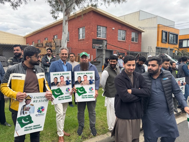 A group of men holding signs

AI-generated content may be incorrect.