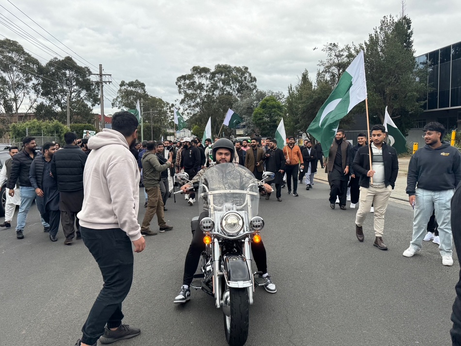 A person on a motorcycle with a crowd of people walking around

AI-generated content may be incorrect.