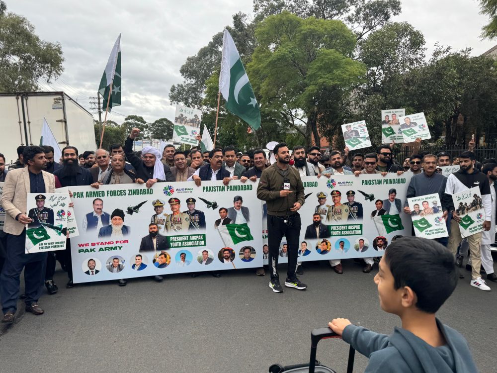 A group of people holding signs

AI-generated content may be incorrect.