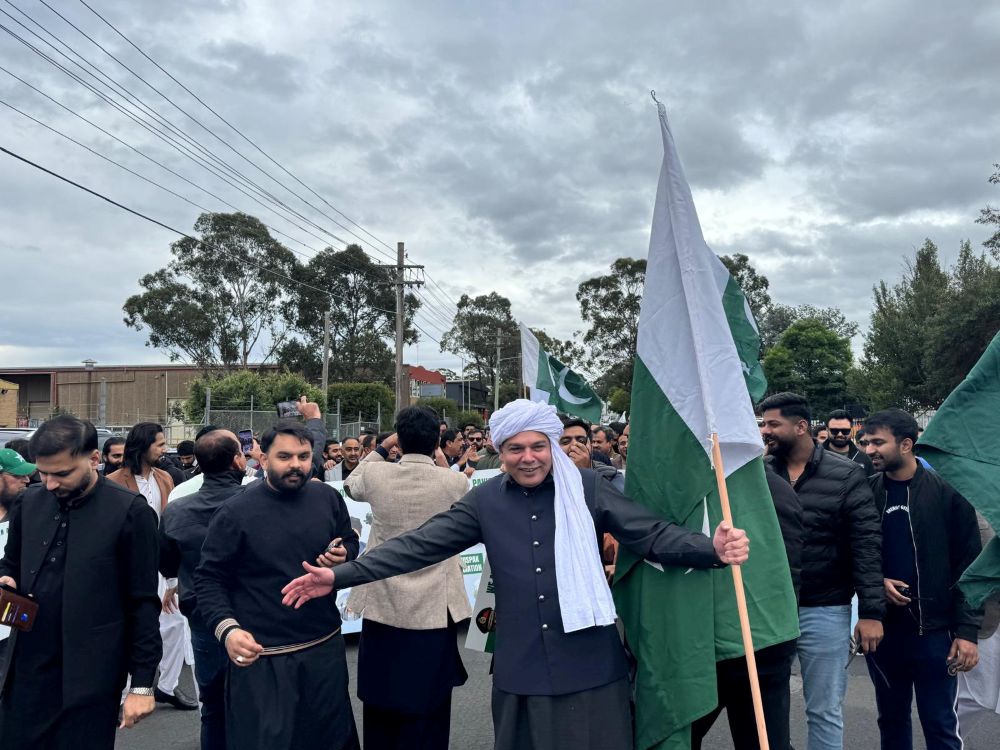A group of people holding flags

AI-generated content may be incorrect.