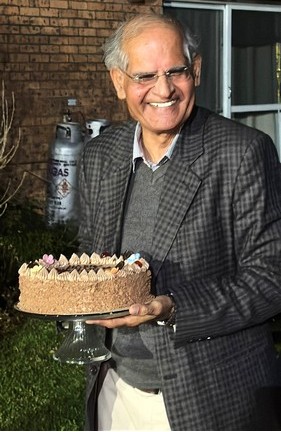 A person holding a cake

AI-generated content may be incorrect.